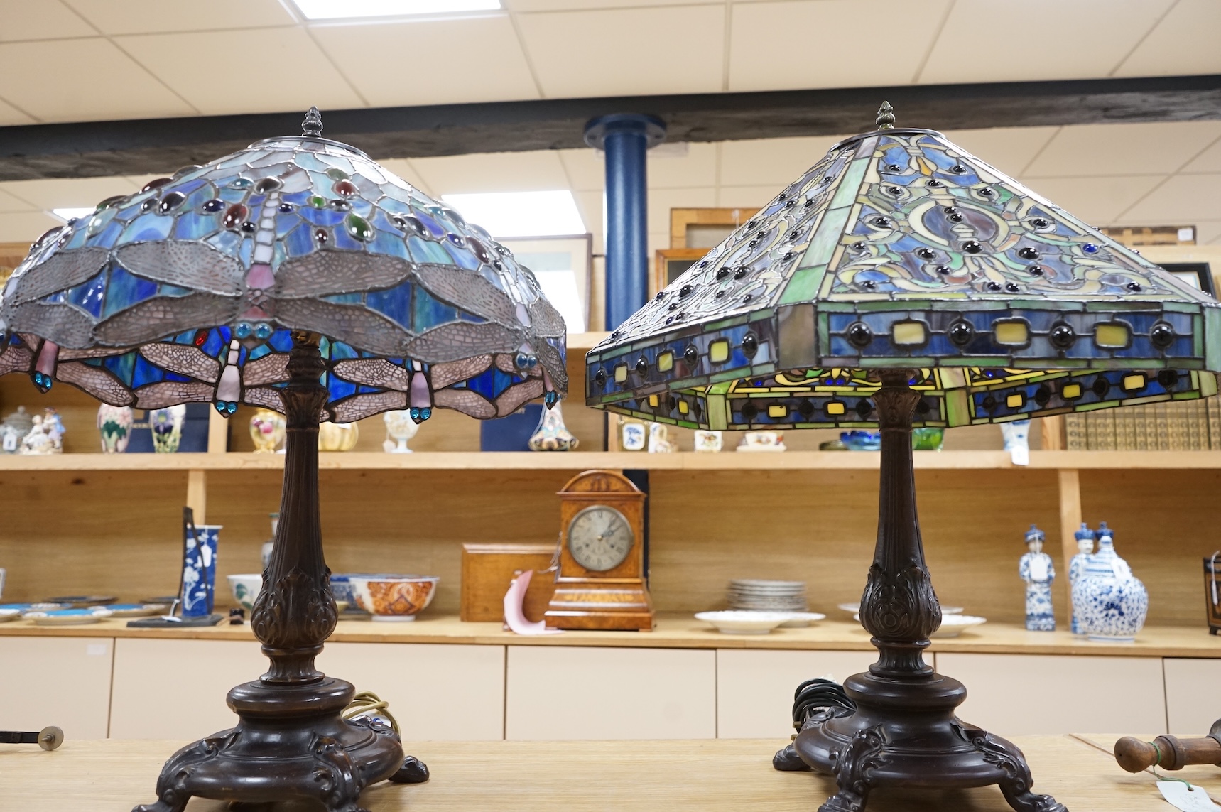 Two Tiffany style table lamps, with ornate glass and metal shades, tallest 72cm high
